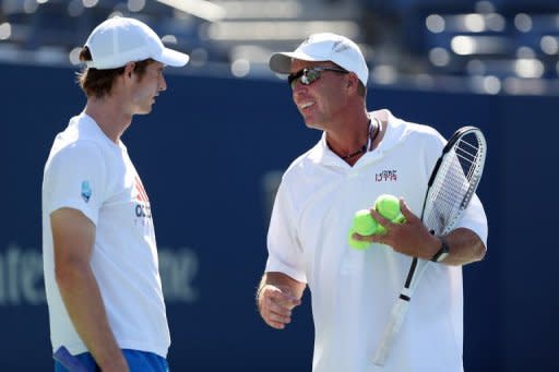 Andy Murray of Great Britain talks with his coach, Ivan Lendl, during the US Open in New York on September 9. A grim-faced Lendl watched Murray throughout the US Open, but even his stoic countenance wavered just a bit as he watched his pupil celebrate a long-awaited first Grand Slam title on Monday