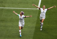 LYON, FRANCE - JULY 07: Megan Rapinoe of the USA celebrates with teammate Alex Morgan after scoring her team's first goal during the 2019 FIFA Women's World Cup France Final match between The United States of America and The Netherlands at Stade de Lyon on July 07, 2019 in Lyon, France. (Photo by Marianna Massey - FIFA/FIFA via Getty Images)