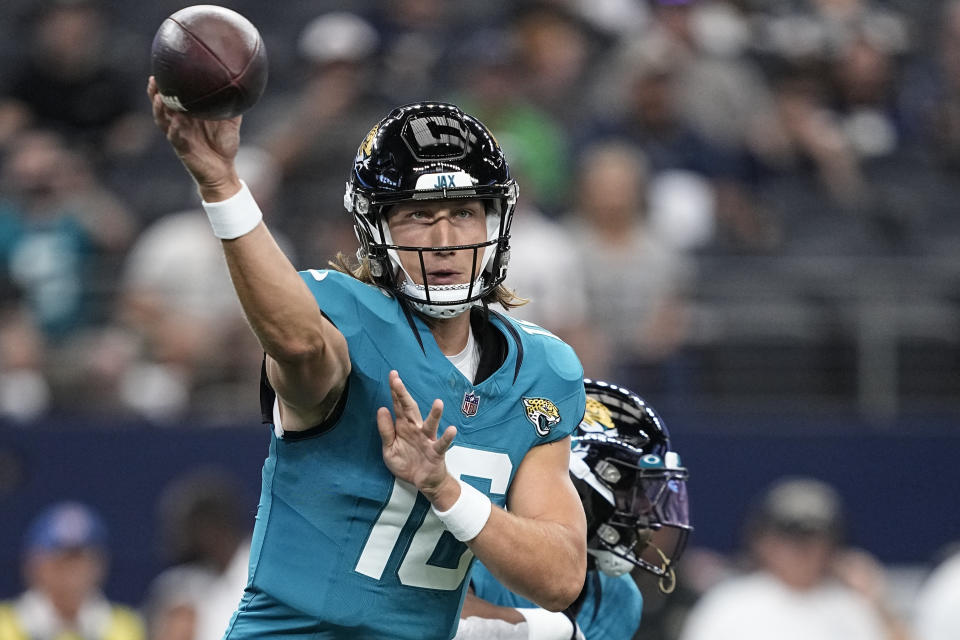 Jacksonville Jaguars quarterback Trevor Lawrence (16) passes the ball during the first half of an NFL preseason football game against the Dallas Cowboys, Saturday, Aug. 12, 2023, in Arlington, Texas. (AP Photo/Tony Gutierrez)