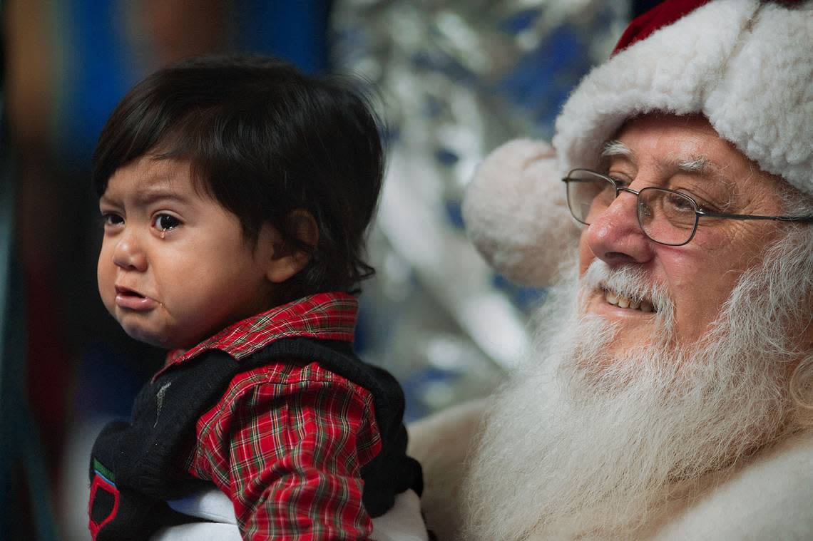 One-year-old Angel Cardoza, of Diamond Springs, sheds a tear on the lap of Paolo “’Santa Paul” Ferro at Arden Fair mall in Sacramento in 2010. Santa said he is seeing longer lines this season and is pleasantly surprised. “The lines are much better this year than last. There’s more happiness.” Randall Benton/Sacramento Bee file