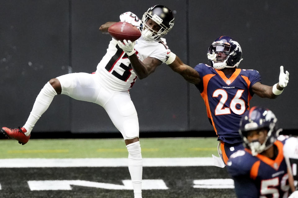 Atlanta Falcons wide receiver Christian Blake (13) makes the catch ahead of Denver Broncos defensive back Kevin Toliver (26) during the first half of an NFL football game, Sunday, Nov. 8, 2020, in Atlanta. (AP Photo/John Bazemore)