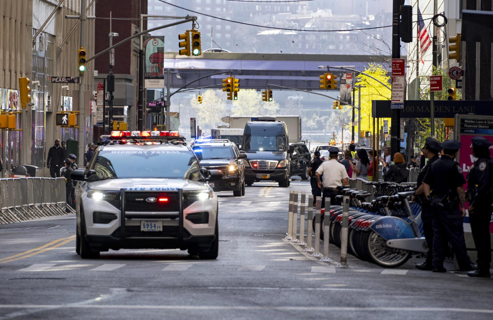 Former President Donald Trump arrives in a motorcade for a deposition in New York Thursday, April 13, 2023. (AP Photo/Craig Ruttle)