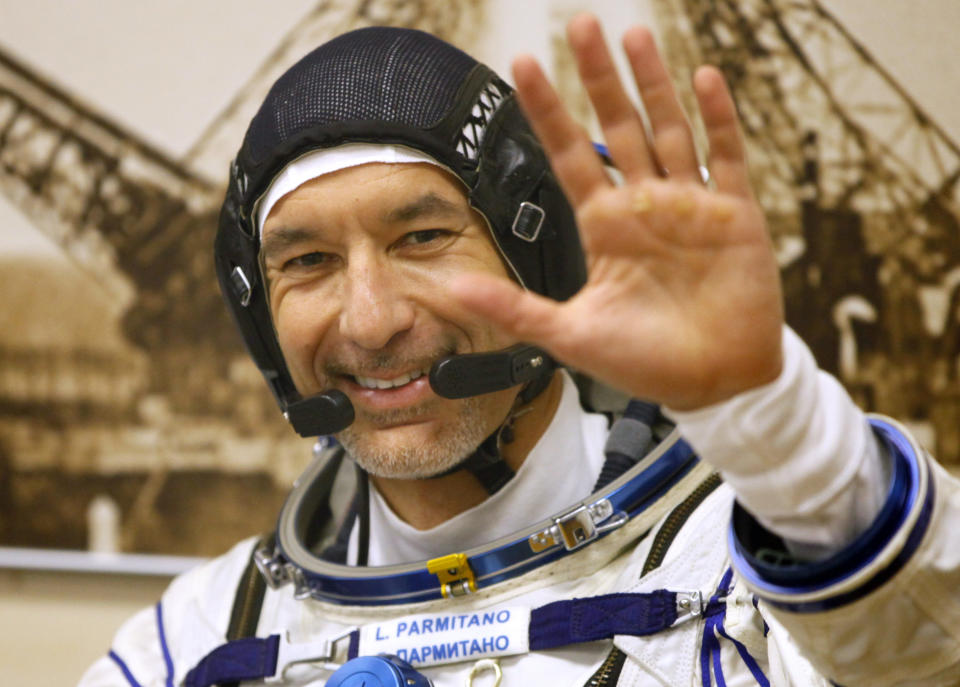 Italian astronaut Luca Parmitano, member of the main crew of the expedition to the International Space Station (ISS), gestures prior the launch of Soyuz MS-13 space ship at the Russian leased Baikonur cosmodrome, Kazakhstan, Saturday, July 20, 2019. (AP Photo/Dmitri Lovetsky)