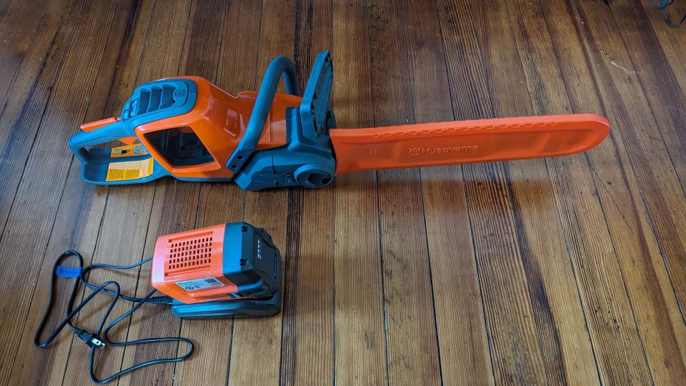 Chainsaw with blade cover and charger