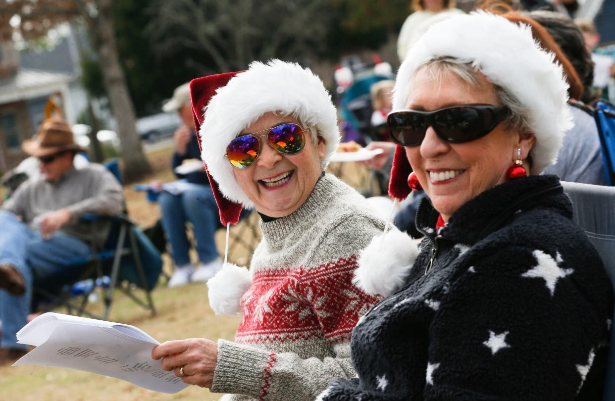 People from the Tuscaloosa community join The Tuscaloosa News for the 17th annual Holiday Singalong in Capitol Park in this 2019 file photo. Linda Selby and Betty Fagen enjoy the singalong. [Staff Photo/Gary Cosby Jr.]