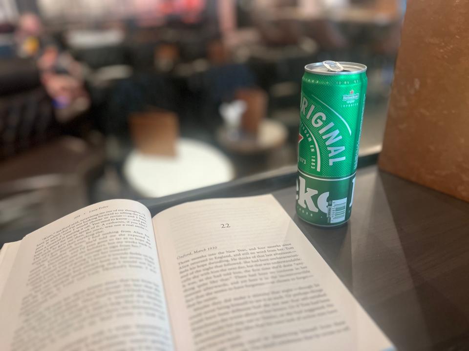 Author's book and Heineken beer.