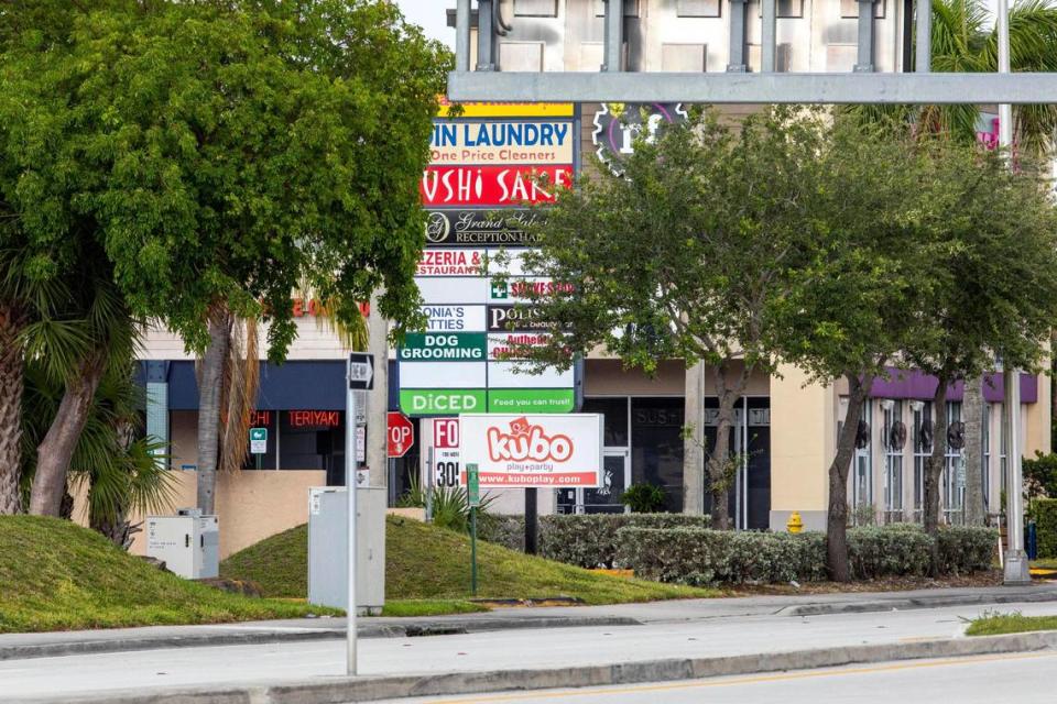 A view looking west on 104th street outside the shopping center where another Miami-Dade mass shooting and a possibly connected car crash killed three people and sent five or six others to the hospital with gunshot wounds, around Grand Salon Reception Hall at Southwest 104th Street and 109th Court in the Kendall neighborhood of Miami, Florida, on Sunday, June 6, 2021.