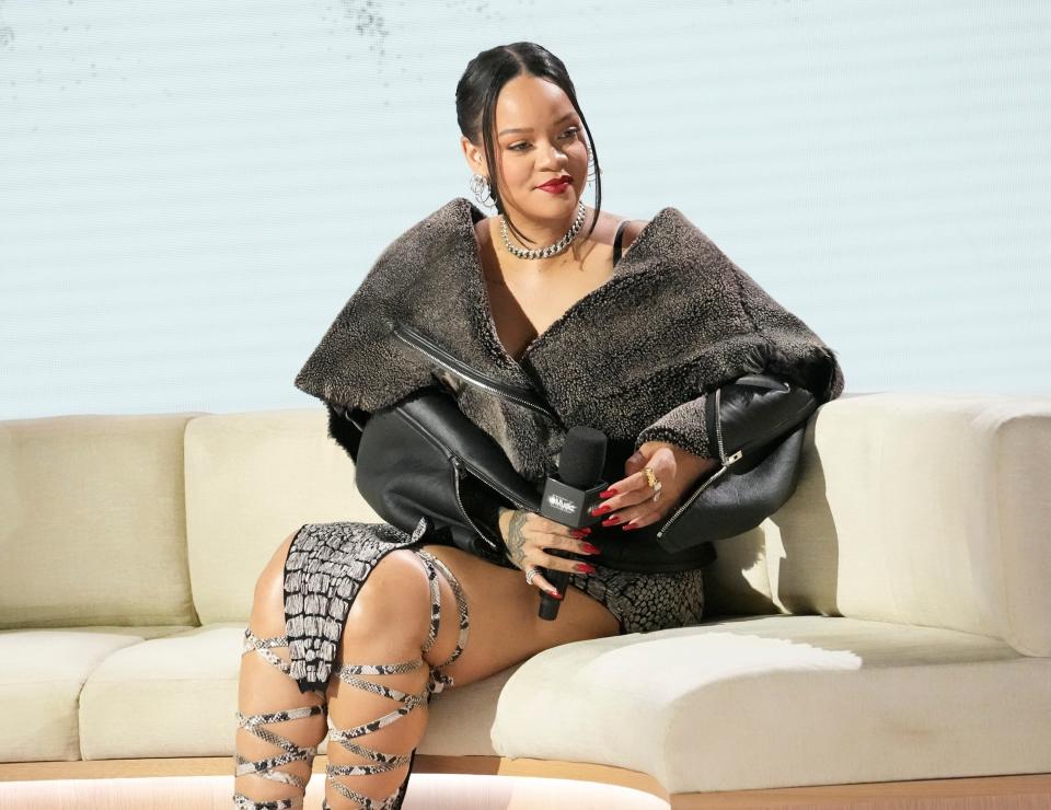 Apple Music Super Bowl LVII Halftime Show talent Rihanna listens to a question during a news conference in Phoenix on Feb. 9, 2023.