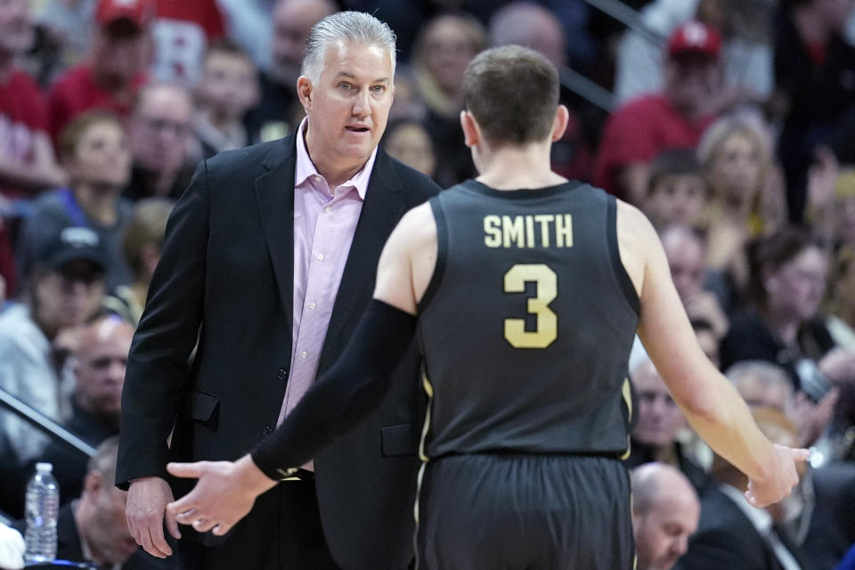 Purdue head coach Matt Painter talks to Braden Smith (3) in the first half of an NCAA college basketball game against Rutgers, Sunday, Jan. 28, 2024, in Piscataway, N.J. (AP Photo/Mary Altaffer)