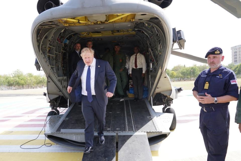 Boris Johnson exits an Indian military Chinook in Ahmedabad after a flight from the JCB factory (Stefan Rousseau/PA) (PA Wire)