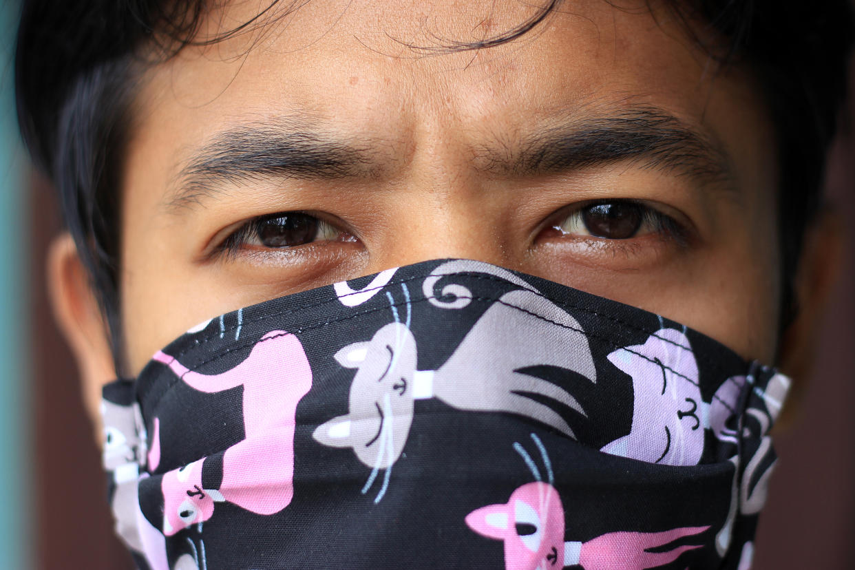 WEST SUMATRA, INDONESIA - APRIL 14, 2020: A citizen wears a mask while exercising in his yard in the city of Padang. Exercise is important in order to keep the body healthy so it is not easily infected with the coronavirus. - PHOTOGRAPH BY Givo Alputra / Opn Images/ Barcroft Studios / Future Publishing (Photo credit should read Givo Alputra / Opn Images/Barcroft Media via Getty Images)