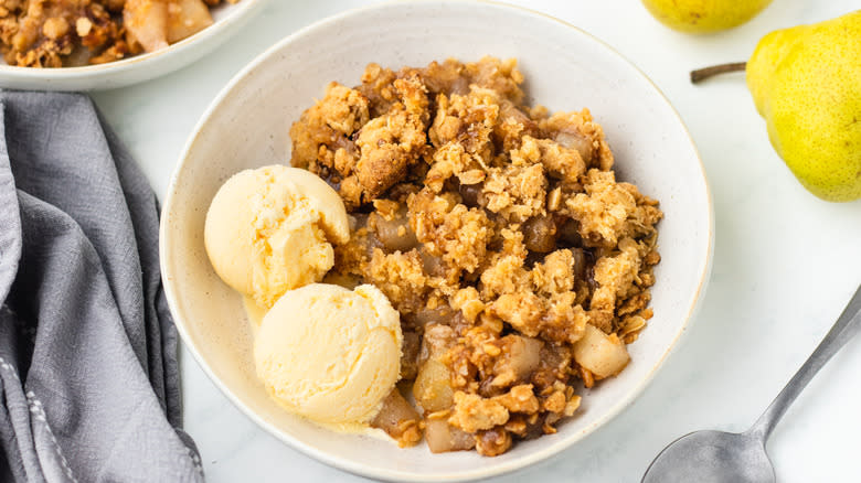 Pear crisp and ice cream in a bowl