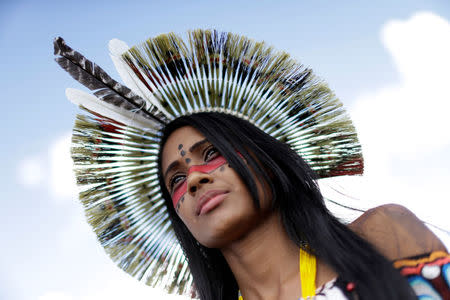 Brazilian indian looks on during a demonstration against the violation of indigenous people's rights, in Brasilia, Brazil April 25, 2017. REUTERS/Ueslei Marcelino