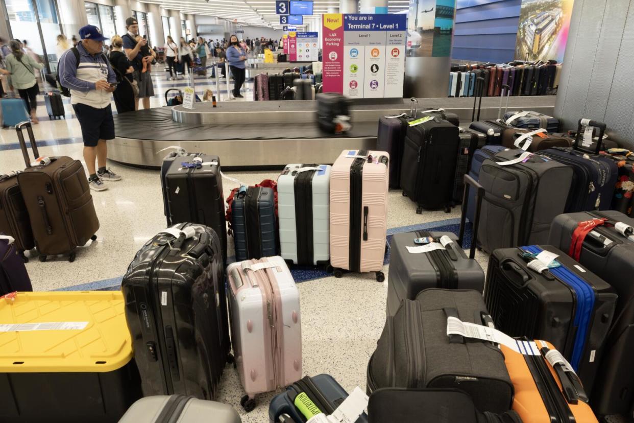 Unclaimed luggage stacks up at Terminal 7 at LAX.