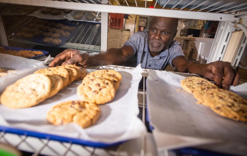 Cleveland Robin puts out trays of freshly baked cookies at Peaches & Cream in Silver Springs Shores.
