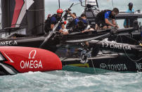 <p>In this photo provided by America’s Cup Event Authority, the crew of Emirates Team New Zealand pickup debris after their boat was righted after capsizing during an America’s Cup challenger semifinal against Great Britain’s Land Rover BAR on the Great Sound in Bermuda on Tuesday, June 6, 2017. (Ricardo Pinto/ACEA via AP) </p>