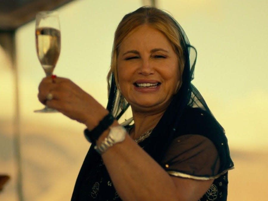 Jennifer Coolidge with white wine