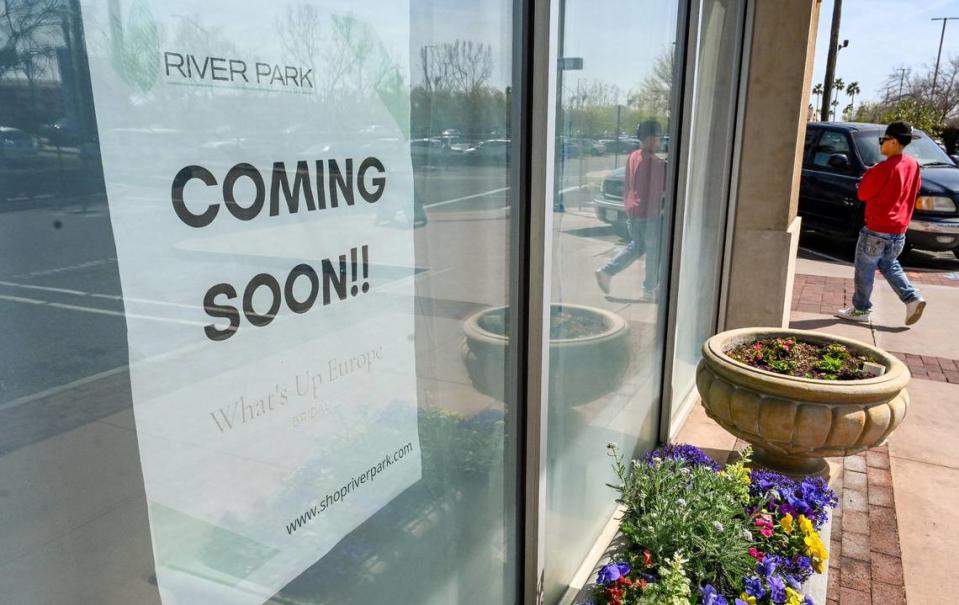 A coming soon sign is posted outside what will be the What’s Up Europe bridal shop in River Park shopping center on Wednesday, April 5, 2023.