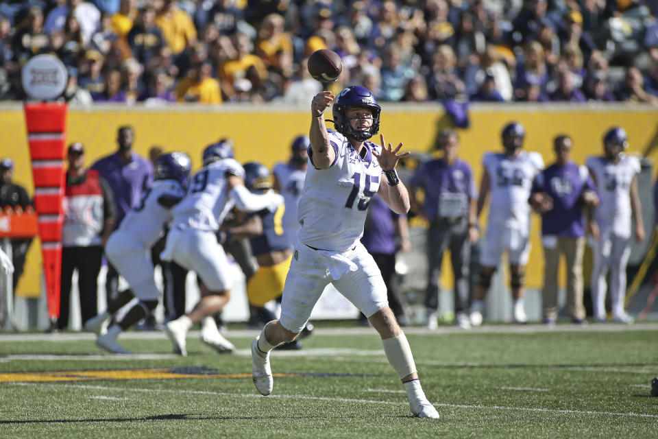 TCU quarterback Max Duggan (15) passes against West Virginia during the first half of an NCAA college football game in Morgantown, W.Va., Saturday, Oct. 29, 2022. (AP Photo/Kathleen Batten)