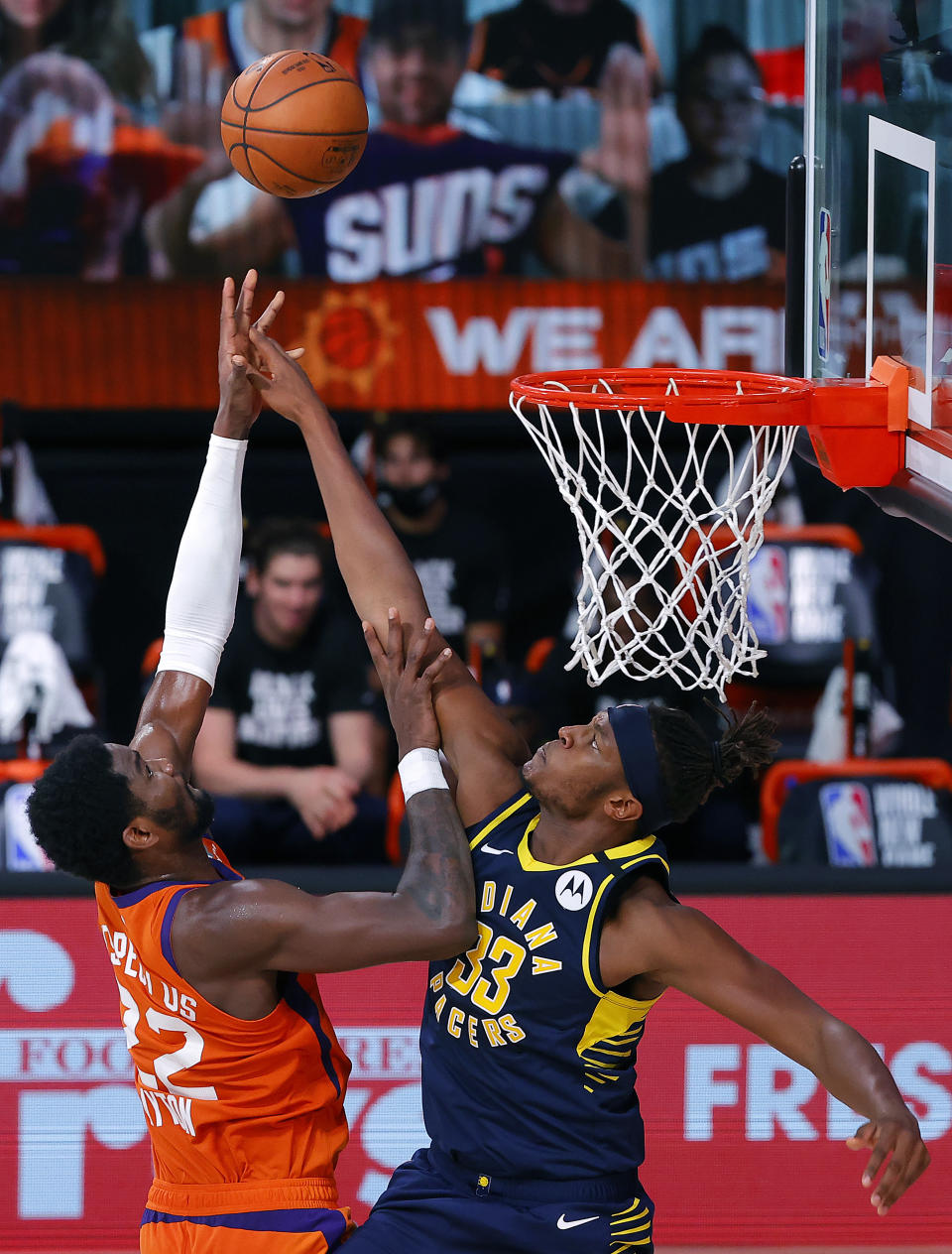 Phoenix Suns' Deandre Ayton (22) shoots the ball as Indiana Pacers' Myles Turner (33) defends during the first half of an NBA basketball game Thursday, Aug. 6, 2020, in Lake Buena Vista, Fla. (Kevin C. Cox/Pool Photo via AP)