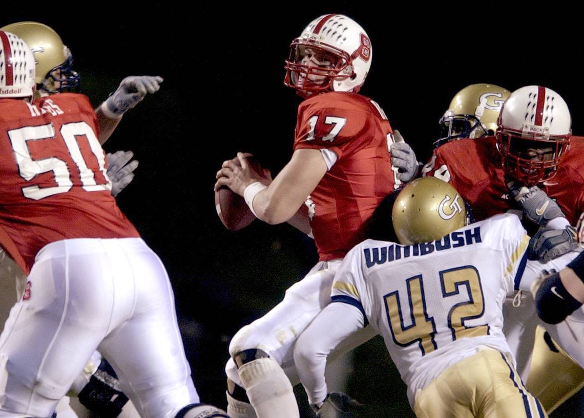 N.C. State’s Philip Rivers is pressured by from three sides by Georgia Tech’s defense during the Wolfpack’s 24-17 loss at Carter-Finley Stadium in 2002. It was the Wolfpack’s first loss of the season.