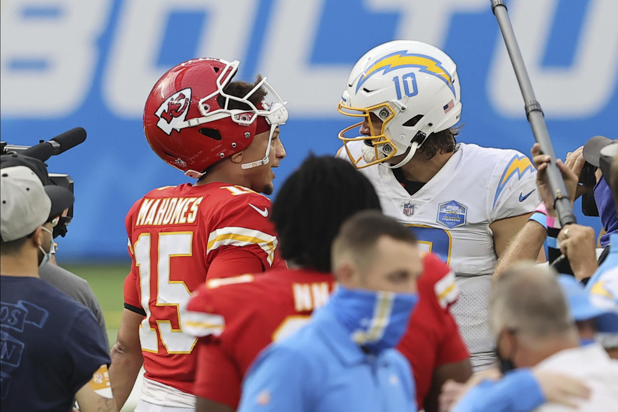 Kansas City Chiefs quarterback Patrick Mahomes (15) and Los Angeles Chargers quarterback Justin Herbert (10) chat after an NFL football game, Sunday, Sept. 20, 2020, in Inglewood, Calif. (AP Photo/Peter Joneleit)