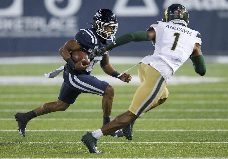 Utah State wide receiver Terrell Vaughn (0) runs downfield as Colorado State defensive back Chigozie Anusiem (1) defends during the first half of an NCAA college football game Saturday, Oct. 7, 2023, in Logan, Utah. | Eli Lucero/The Herald Journal via AP