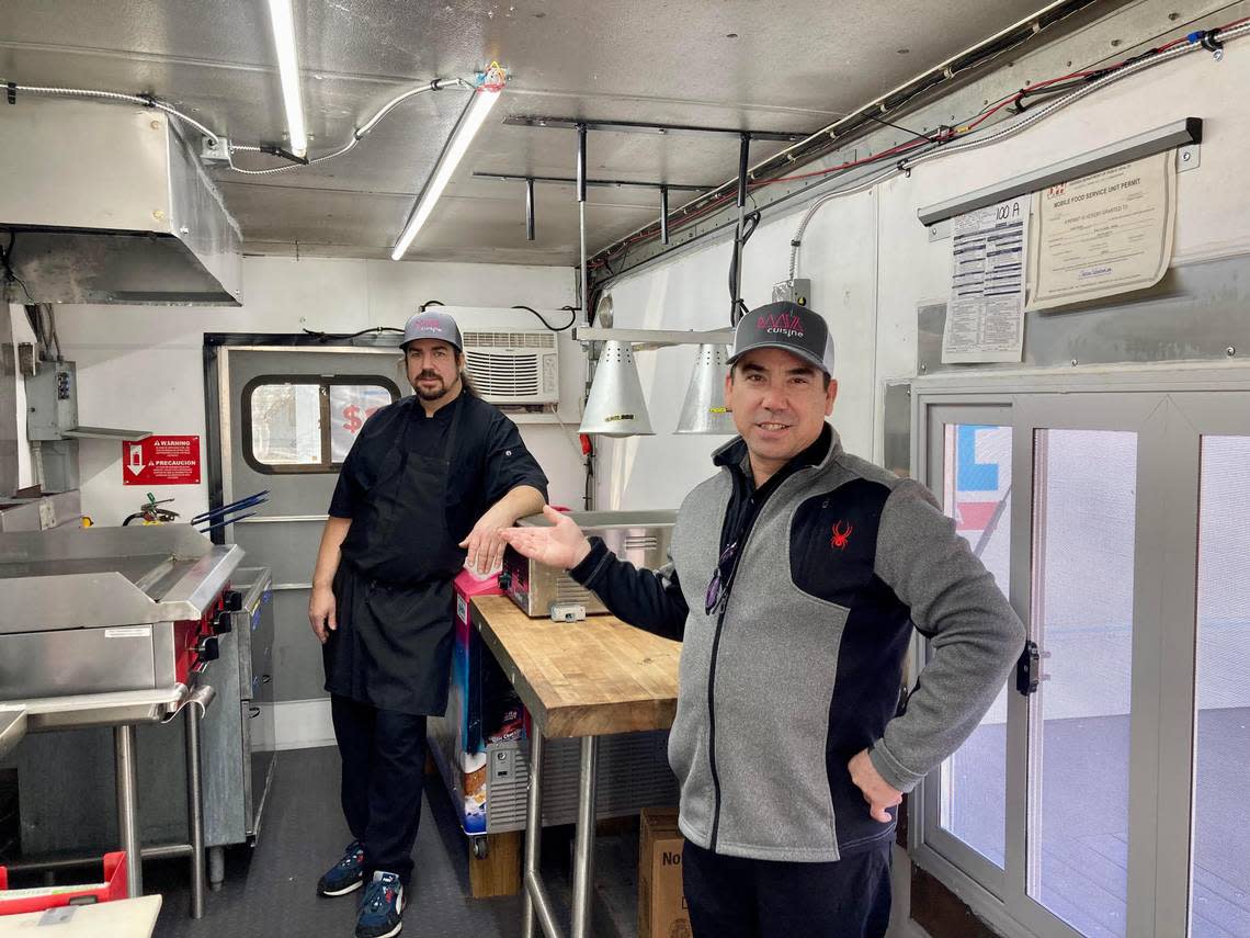 Chefs Jason Delasota, right front, and Scott Kiernan inside their new Root 76 Cuisine food truck that will soon serve international streets foods for lunch off Watson Boulevard in Warner Robins next to their new drive-thru commissary to offer breakfast. They expect to open both in January. They also offer catering.