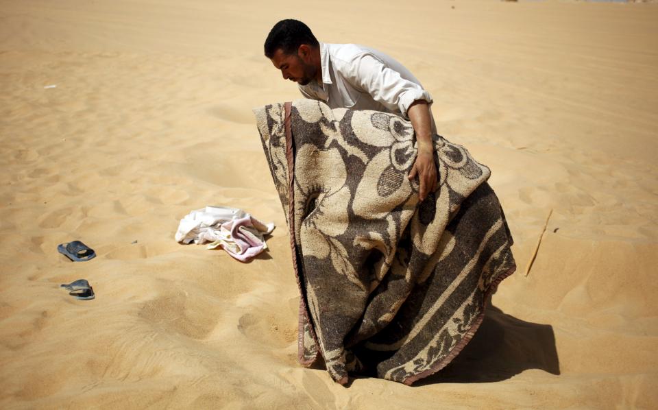 Wider Image: The Hot Sand Baths of Siwa