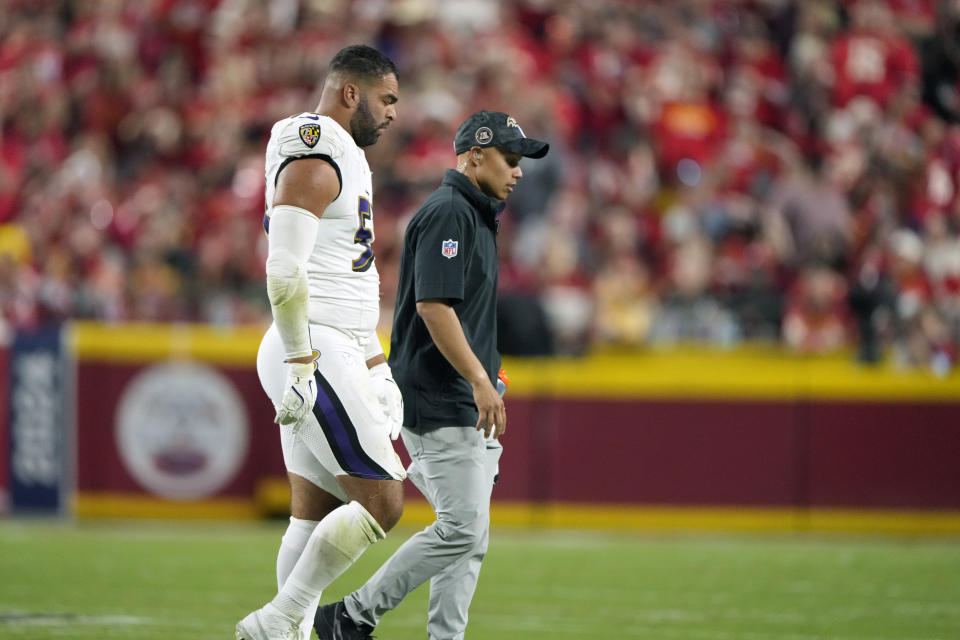 Kyle Van Noy leaves the field after breaking an orbital bone last week against the Chiefs. (AP Photo/Charlie Riedel)