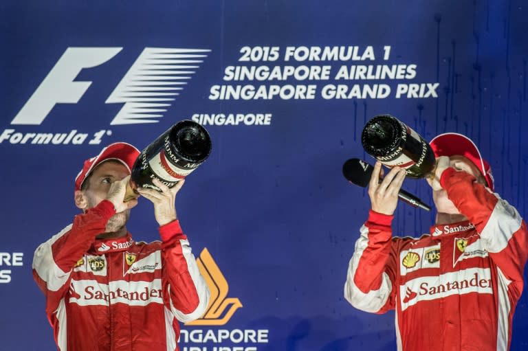 Sebastian Vettel (L) and Kimi Raikkonen finished first and third respectively at the Singapore Grand Prix, giving Ferrari a double on the podium on September 20, 2015