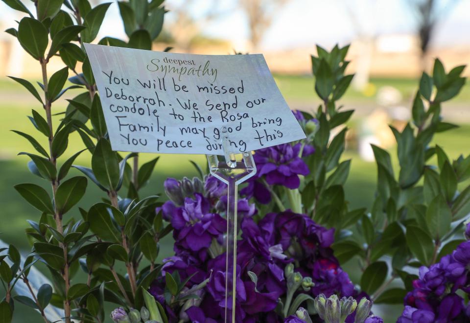 A message expresses sympathy on a floral arrangement at the Coachella Valley Public Cemetery in Coachella, Calif., February 9, 2022. 
