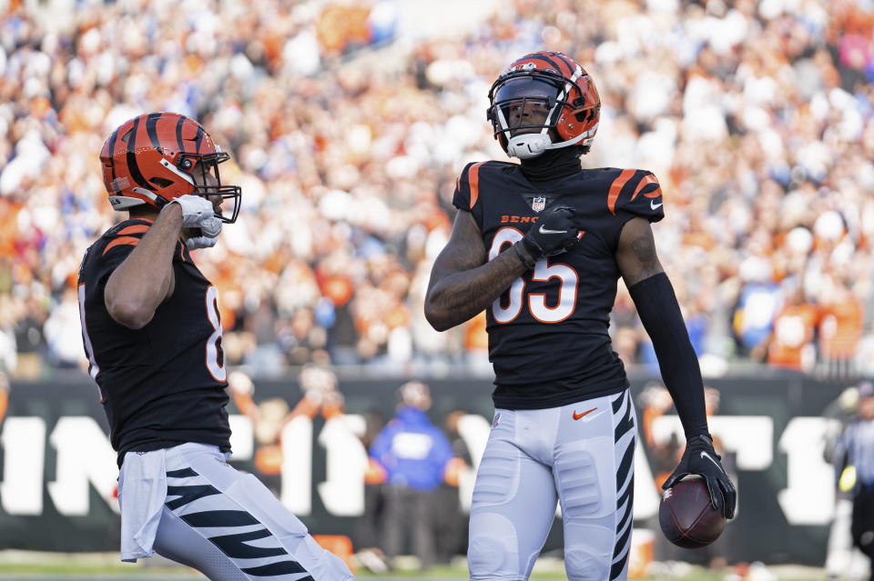 Cincinnati Bengals' Tee Higgins (85) celebrates a touchdown reception during the first half of an NFL football game against the Los Angeles Chargers, Sunday, Dec. 5, 2021, in Cincinnati. (AP Photo/Jeff Dean)