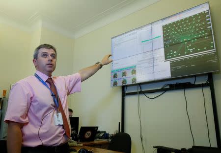 Roman Borodin, the head of the IT department of the Ukrainian Presidential Administration, points to a monitor showing activity on the network, during an interview with Reuters in Kiev, Ukraine July 26, 2017. REUTERS/Valentyn Ogirenko