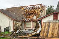A home is damaged on Kent Drive where a tornado was reported to pass near Mickey Gilley Blvd. and Fairmont Parkway, Tuesday, Jan. 24, 2023, in Pasadena, Texas. (Mark Mulligan/Houston Chronicle via AP)