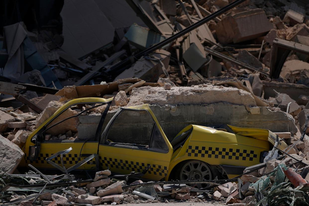 A taxi is buried in rubble at the site of the five-star Hotel Saratoga after a deadly explosion in Old Havana, Cuba, on Friday.