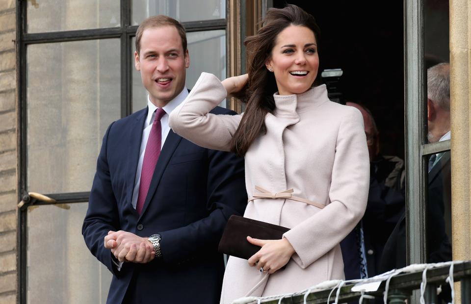 Catherine, Duchess of Cambridge and Prince William, Duke of Cambridge smile and wave to the crowds from the balcony of Cambridge Guildhall as they pay an official visit to Cambridge on November 28, 2012 in Cambridge, England. (Photo by Chris Jackson/Getty Images)