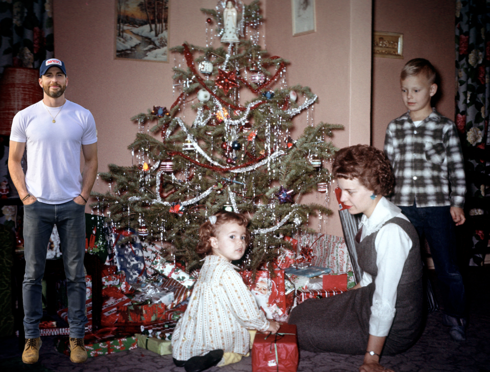 chris photoshopped in front of a christmas tree with a random family