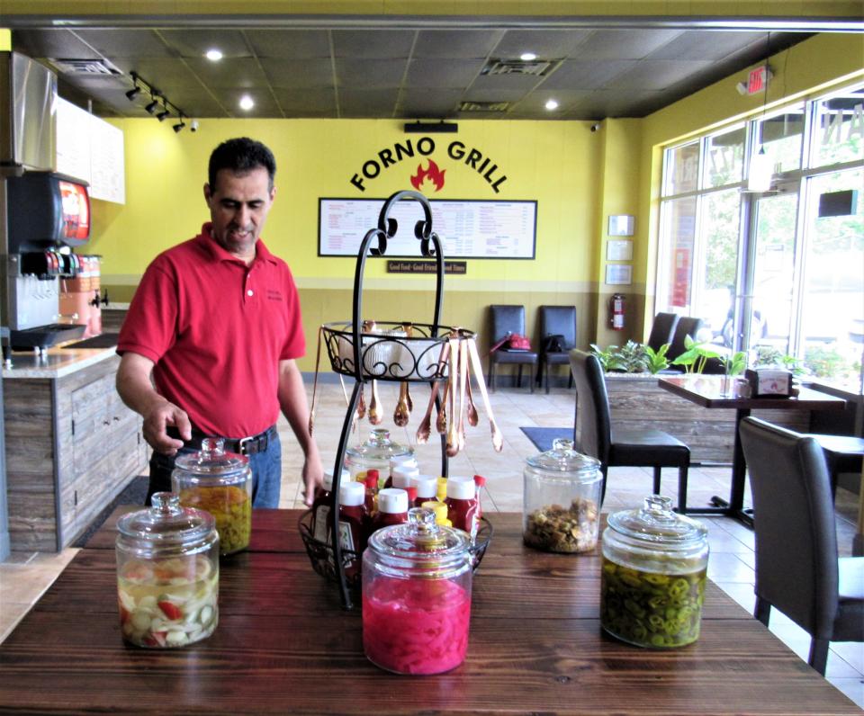 Add your own banana peppers, giardiniera Italian vegetables, jalapenos, and even pickled turnips from the condiment bar at Forno Grill.