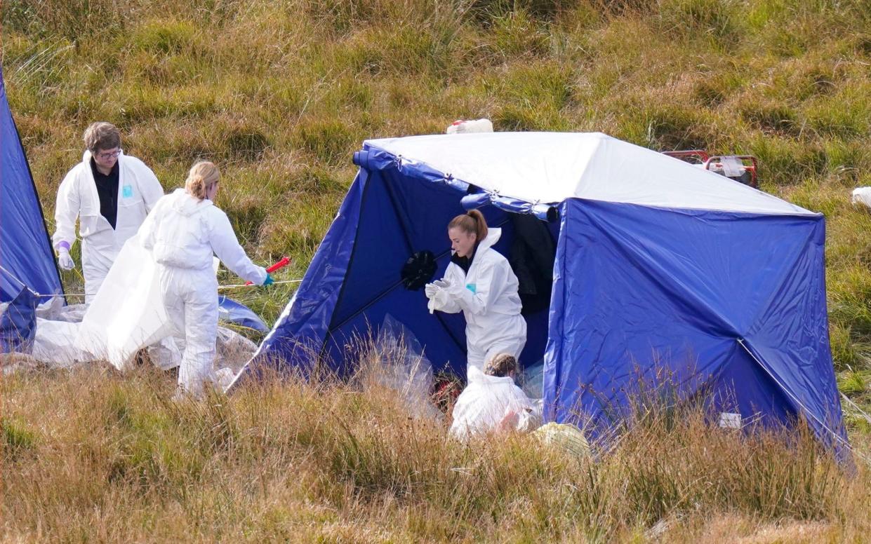 Officers from Greater Manchester Police continue a search on Saddleworth Moor for the remains of the body of 12-year-old Keith Bennett - PA