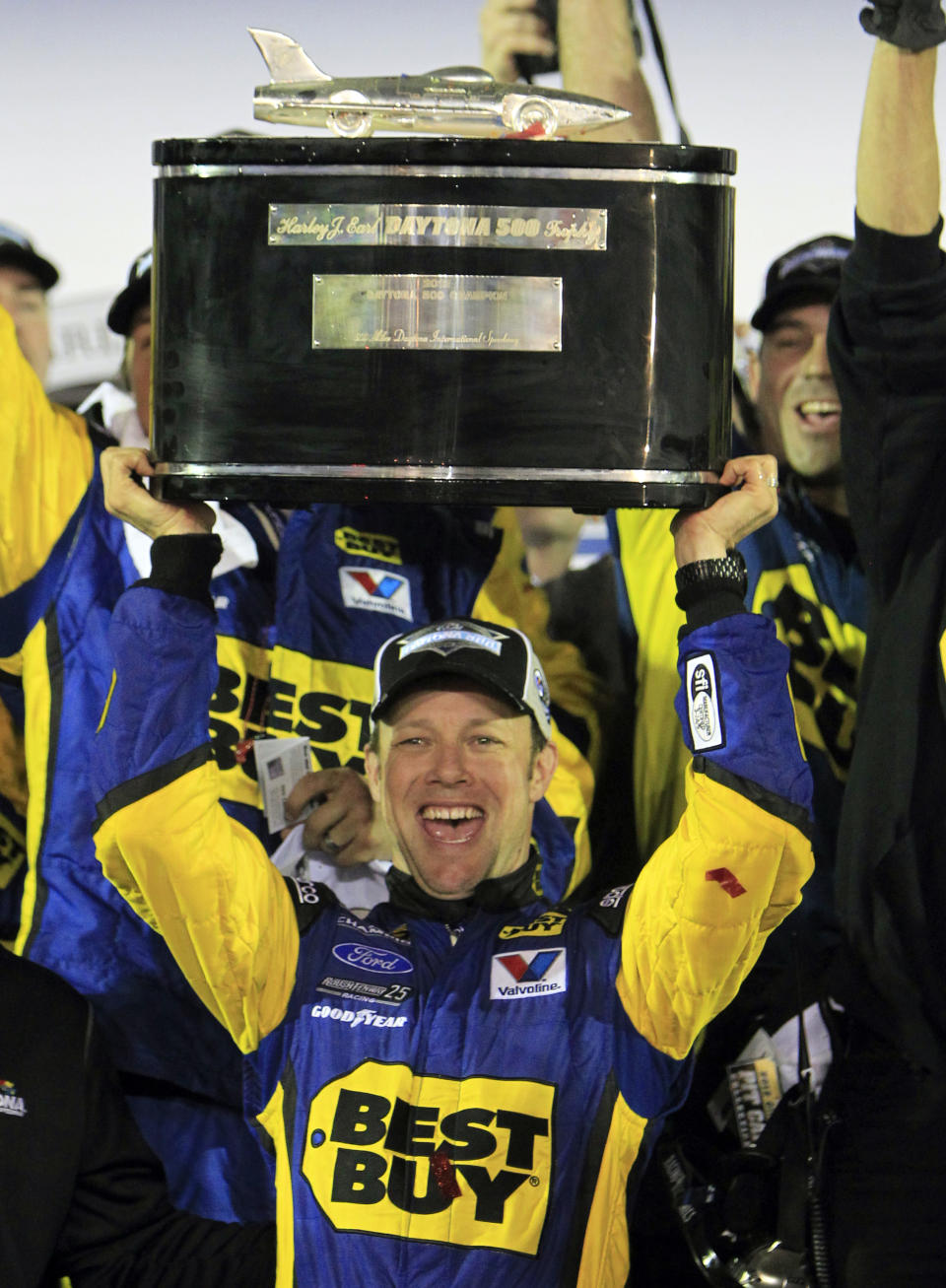 Matt Kenseth hoists the trophy in victory lane after winning the NASCAR Daytona 500 Sprint Cup series auto race at Daytona International Speedway in Daytona Beach, Fla., Tuesday, Feb. 28, 2012. (AP Photo/John Raoux)