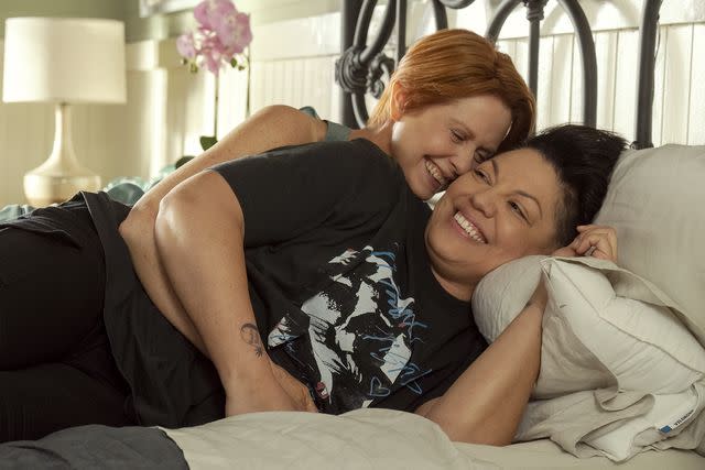 Craig Blakenhorn/HBO Max Cynthia Nixon's Miranda cuddles Sara Ramirez's Che in 'And Just Like That' season 2