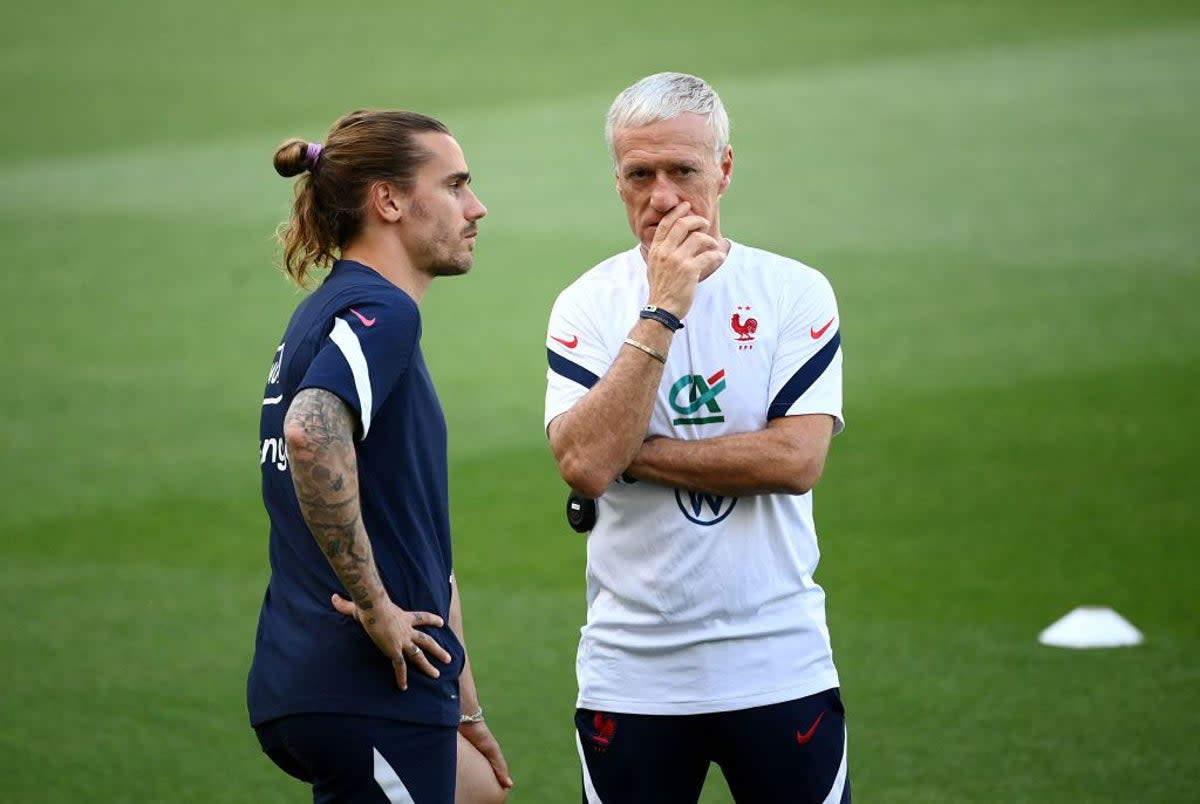 Antoine Griezmann with France manager Didier Deschamps  (AFP via Getty Images)