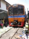 <b>Maeklong railway market</b><br><br><p><b>A marketplace with a working railway track through it.</b></p><br><br><p>If you’re driving from Bangkok to Hua Hin (which takes about 2.5 hours), make sure you schedule a stop in Maeklong Railway Market in Samut Songkhram, some 60km away from the capital. Locals call it Talad Rom Hoop Market, which translates to “Market Umbrella Pulldown” but tourists call it Scary Market (read on to find out why). At first glance, it looks like any typical open-air market in Thailand. The market is filled with stalls displaying juicy fruits, fresh vegetables, a variety of spices, herbs, seafood and plenty more. </p>