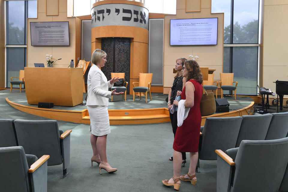 Chloe Akers, left, talks with Rabbi Laurie Rice and Dr. Nancy Lipsitz, right, before giving a presentation at Congregation Micah synagogue, Friday, Aug. 5, 2022 in Brentwood, Tenn. A gynecologist, Lipsitz describes the fear she’s seen in her patients. One decided to move out of state. Another asked her: If things go bad, will you have to let me die? (AP Photo/John Amis)