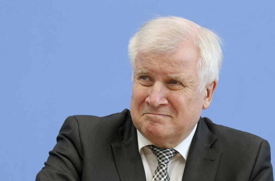 German Interior minister Horst Seehofer attends a news conference in Berlin, Germany, Tuesday, May 14, 2019. German security officials say the number of anti-Semitic and anti-foreigner incidents rose in the country last year, despite an overall fall in politically motivated crimes. (Wolfgang Kumm/dpa via AP)