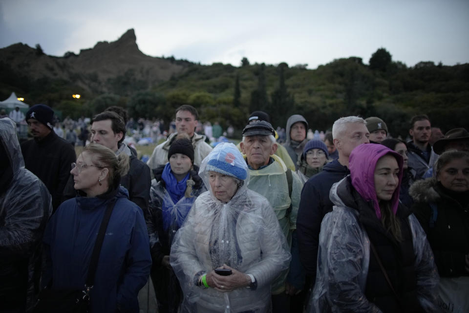 People gather to attend the Dawn Service ceremony at the Anzac Cove beach, the site of the April 25, 1915, World War I landing of the ANZACs (Australian and New Zealand Army Corps) on the Gallipoli peninsula, Turkey, early Tuesday, April 25, 2023. During the 108th Anniversary of Anzac Day, people from Australia and New Zealand joined Turkish and other nations' dignitaries at the former World War I battlefields for a dawn service Tuesday to remember troops that fought during the Gallipoli campaign between British-led forces against the Ottoman Empire army. (AP Photo/Emrah Gurel)