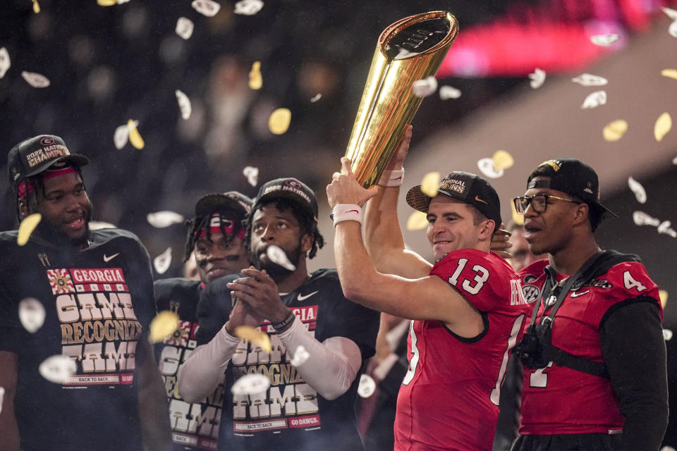 Georgia quarterback Stetson Bennett (13) celebrates victory over TCU after the national championship NCAA College Football Playoff game, Monday, Jan. 9, 2023, in Inglewood, Calif. Georgia won 65-7. (AP Photo/Mark J. Terrill)