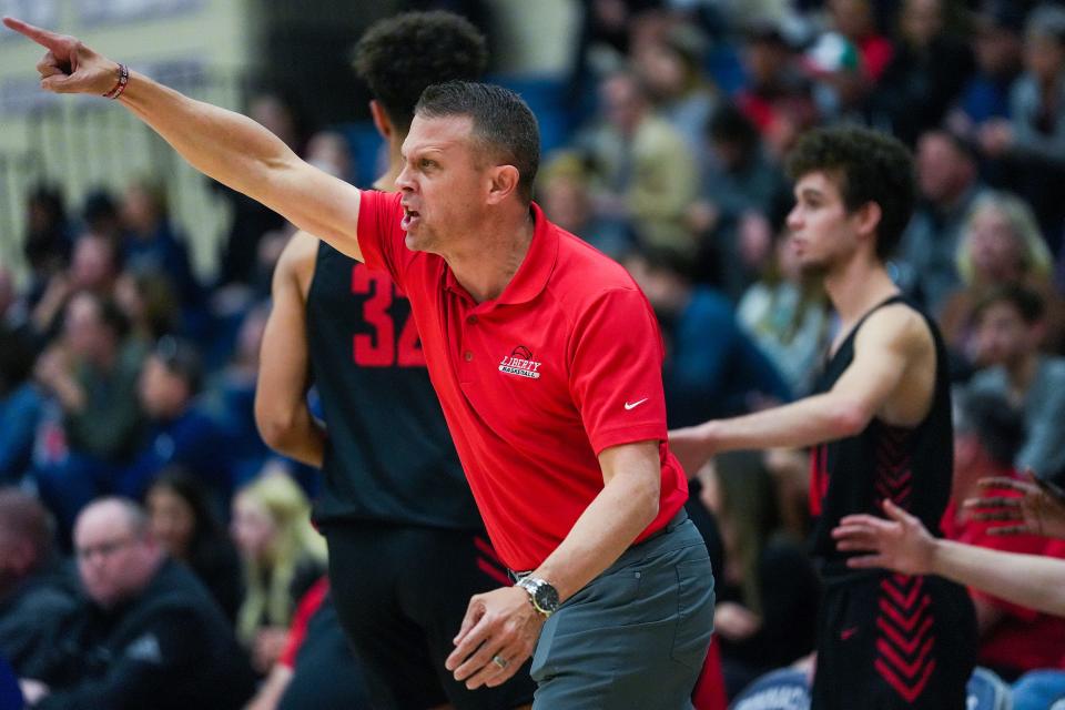 Liberty head coach Mark Wood shouts directions at his team during the first half against Liberty High School at Pinnacle High School on Thursday, Feb. 17, 2022, in Phoenix.