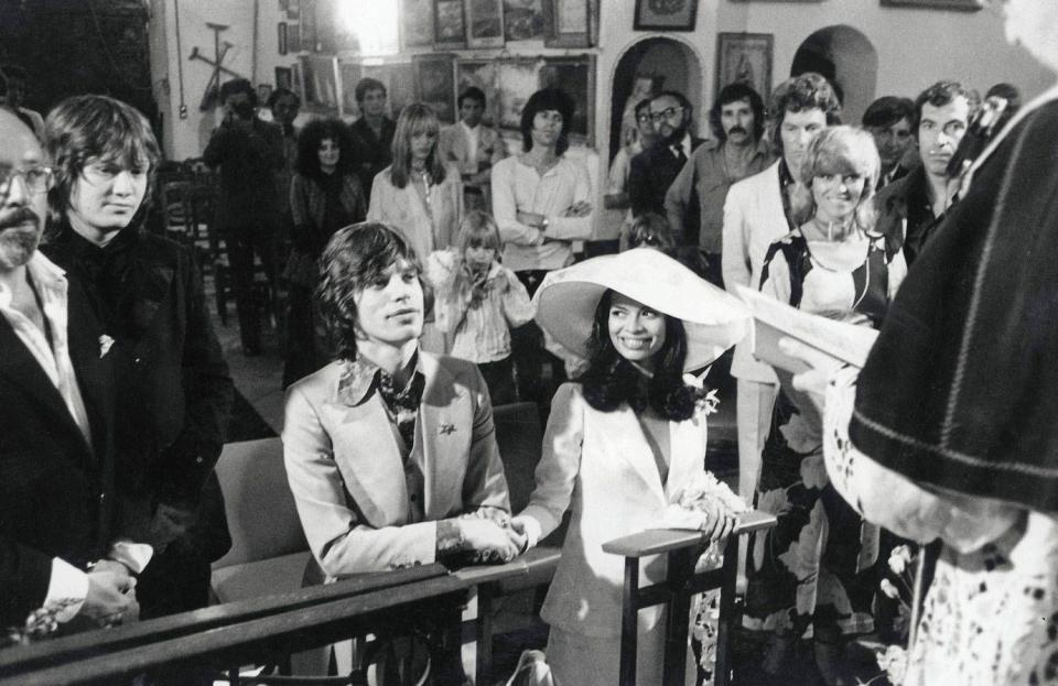 <p>Mick Jagger sits next to his bride, Bianca Pérez-Mora Macias, during their wedding ceremony in a small church in St. Tropez. </p>